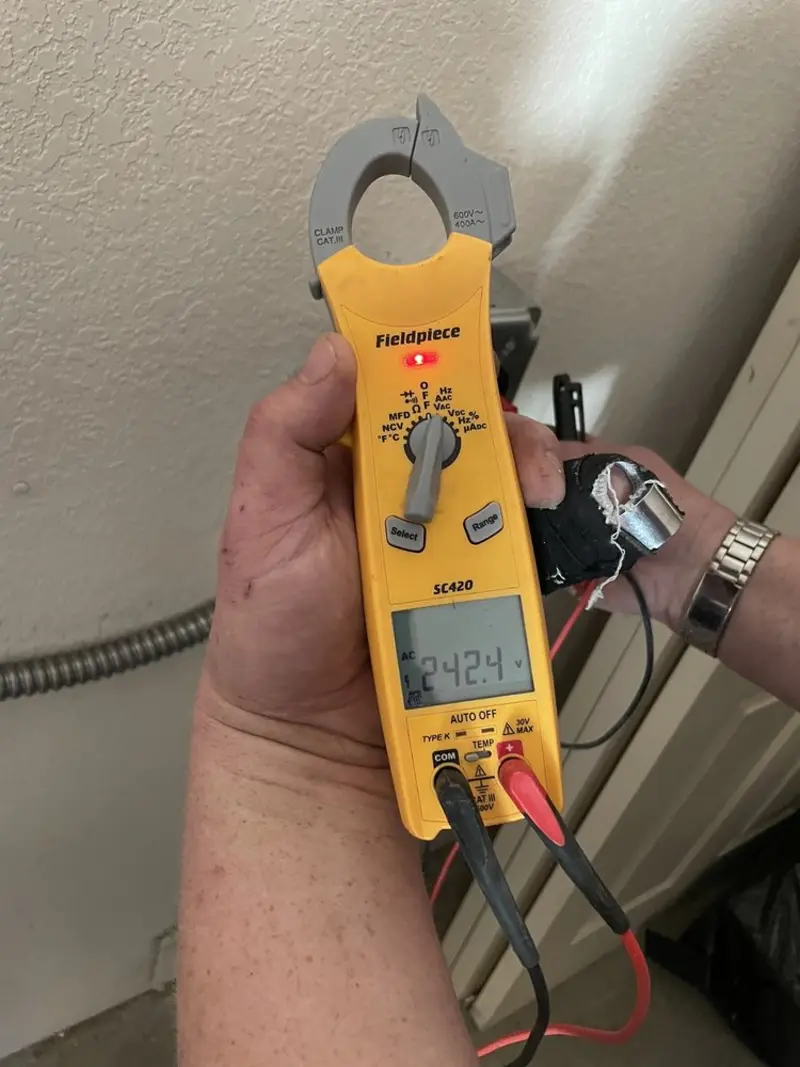 Voltage testing with clamp meter during Outlet Installation in Manteca